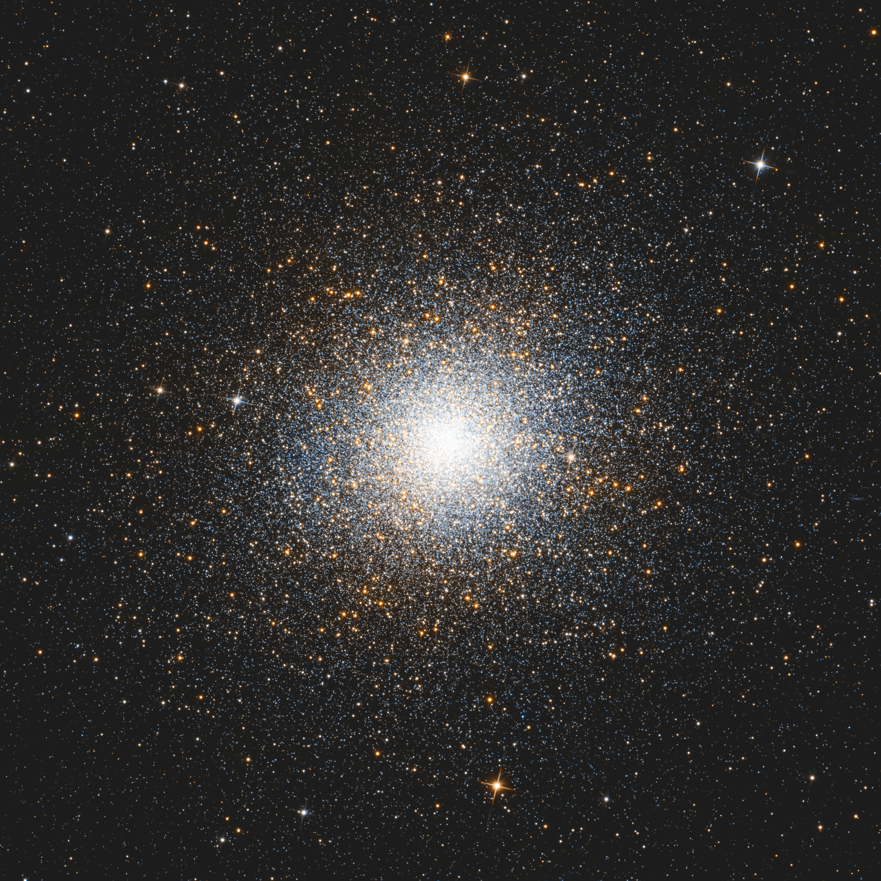 Omega Centauri forming a densely packed sphere of warm stars on a dark background.